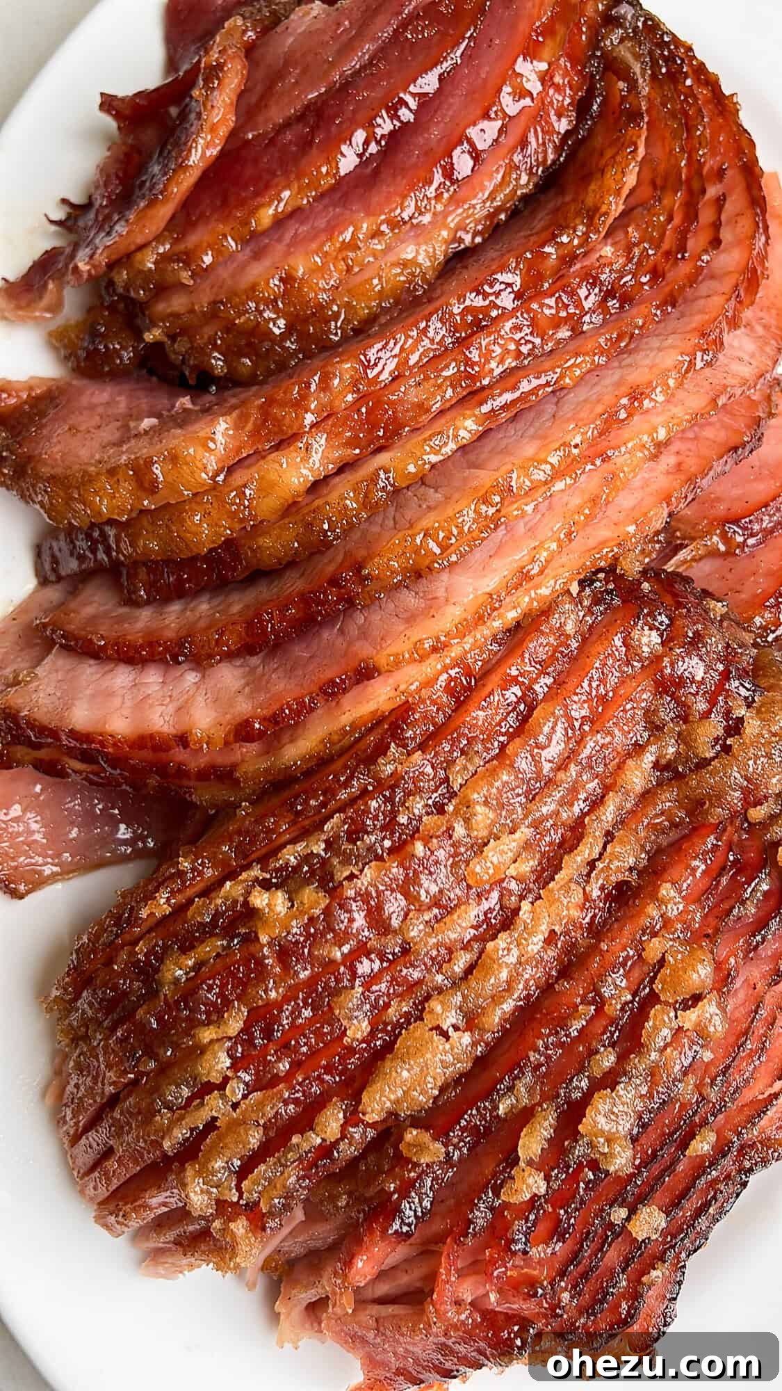Tender Honey Glazed Slow Cooker Ham 3 sliced ham sitting on a plate