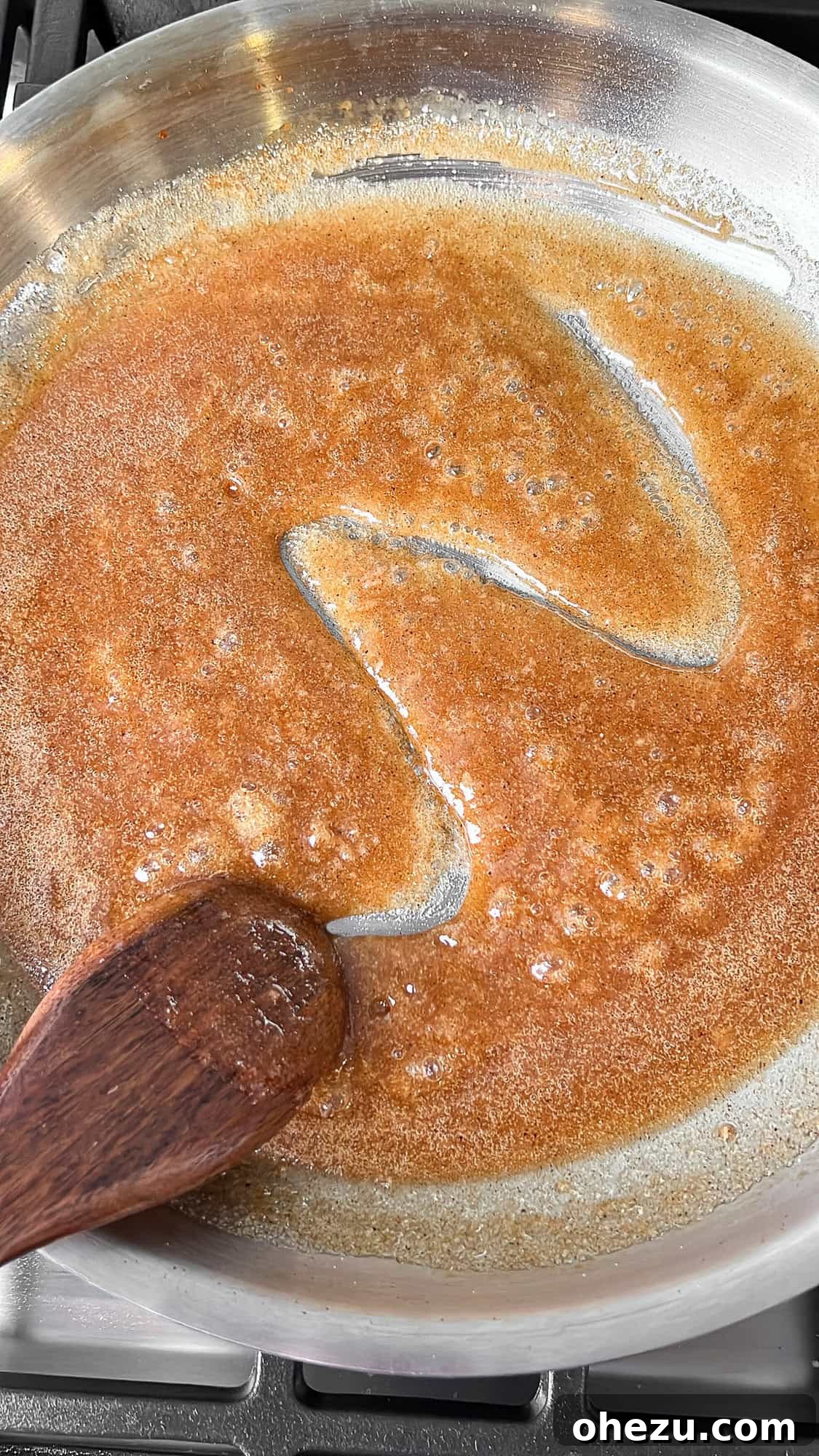 Tender Honey Glazed Slow Cooker Ham 8 sugar glaze for the ham, bubbling in a pan
