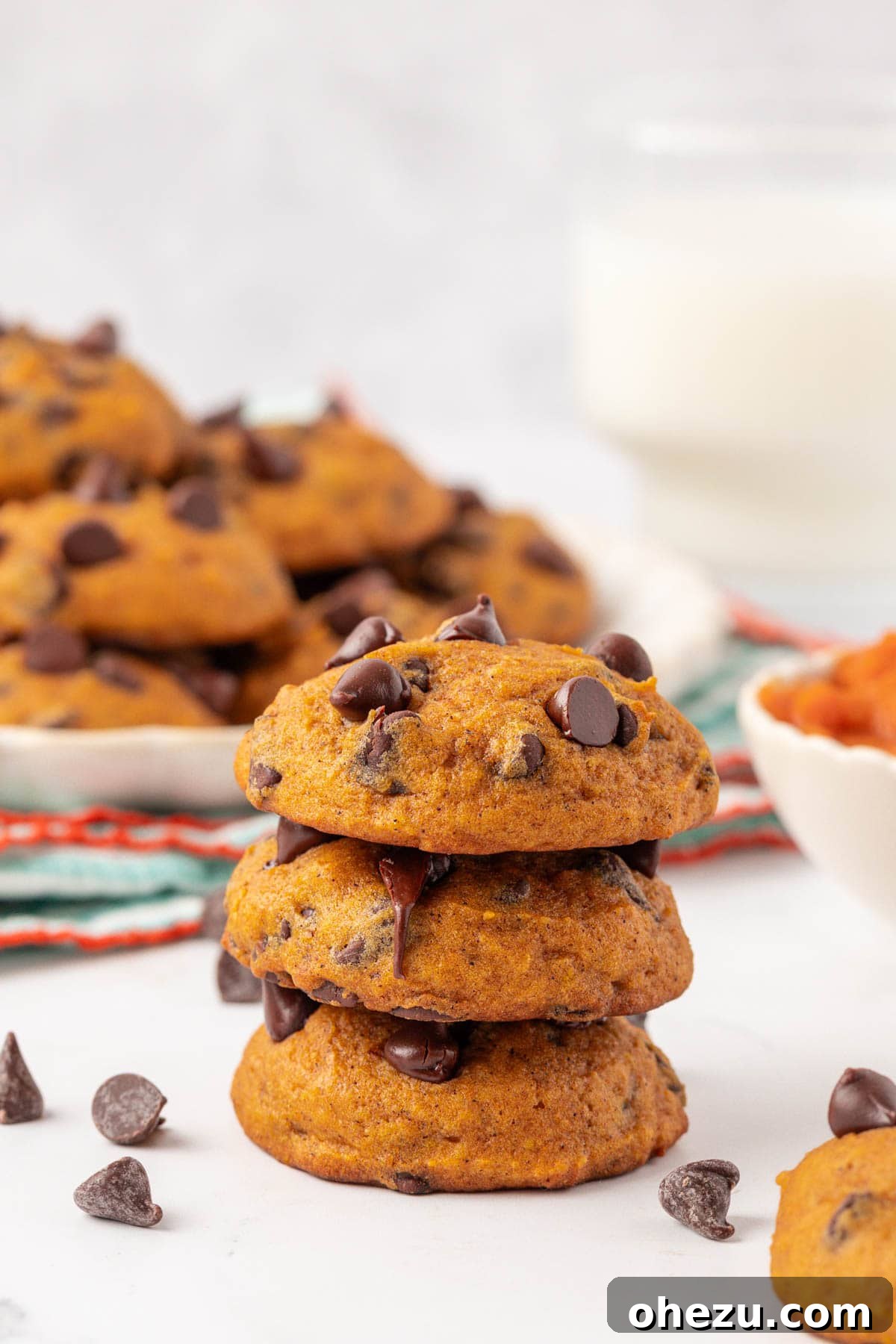 Harvest Pumpkin Chocolate Chip Cookies 18 Stacked pumpkin chocolate chip cookies, ready to be enjoyed
