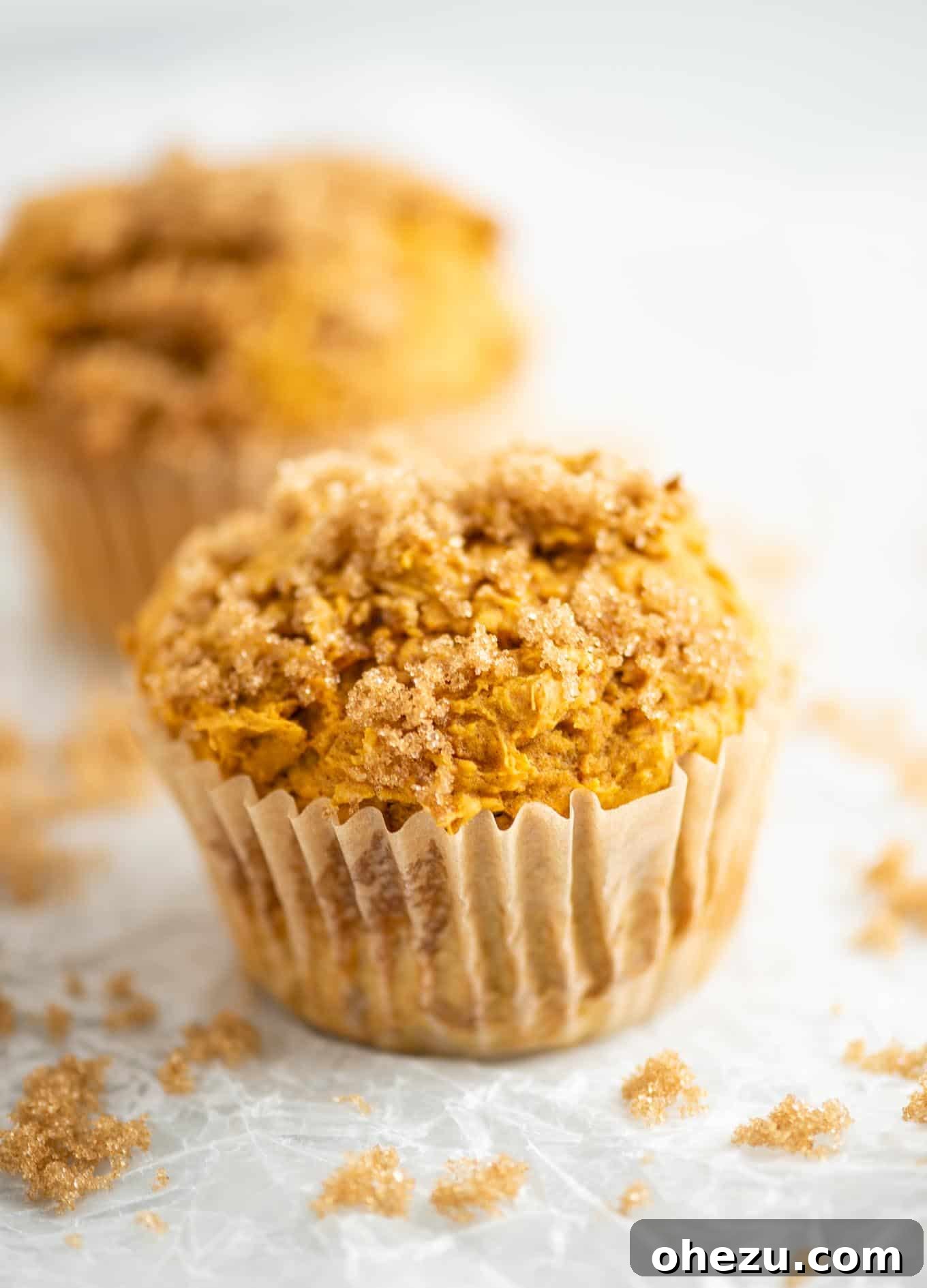 A perfectly baked cake mix pumpkin muffin with a crunchy brown sugar topping, ready to be enjoyed