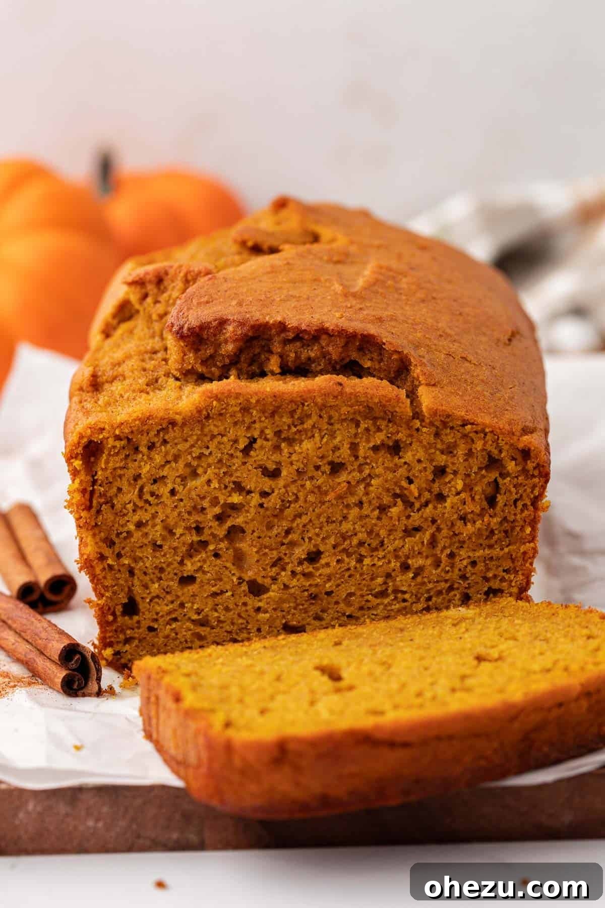 Delicious slices of cake mix pumpkin bread on a rustic plate, ready to be enjoyed.