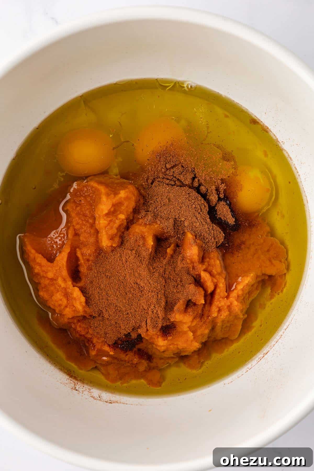 Wet ingredients in a mixing bowl before combining.