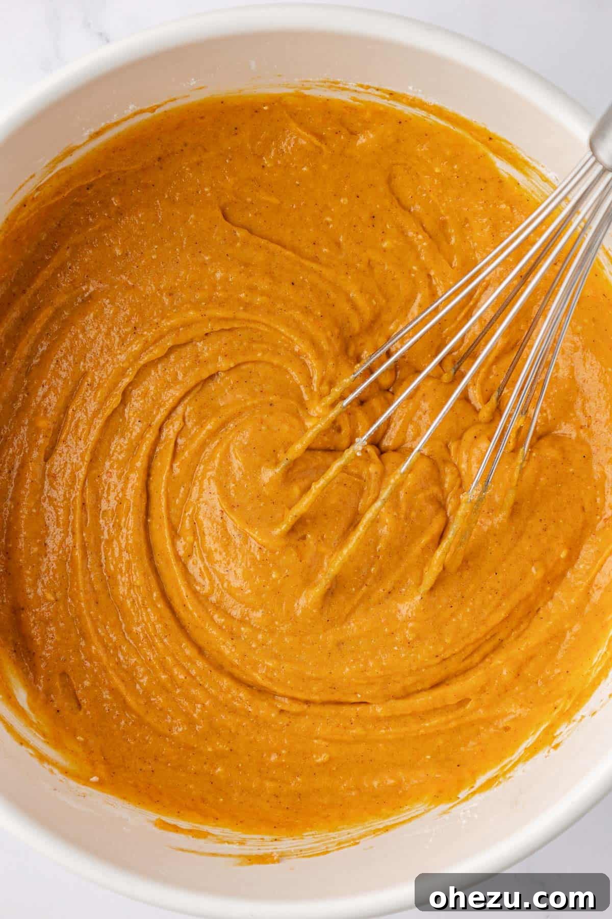 Pumpkin bread batter smoothly whisked together.