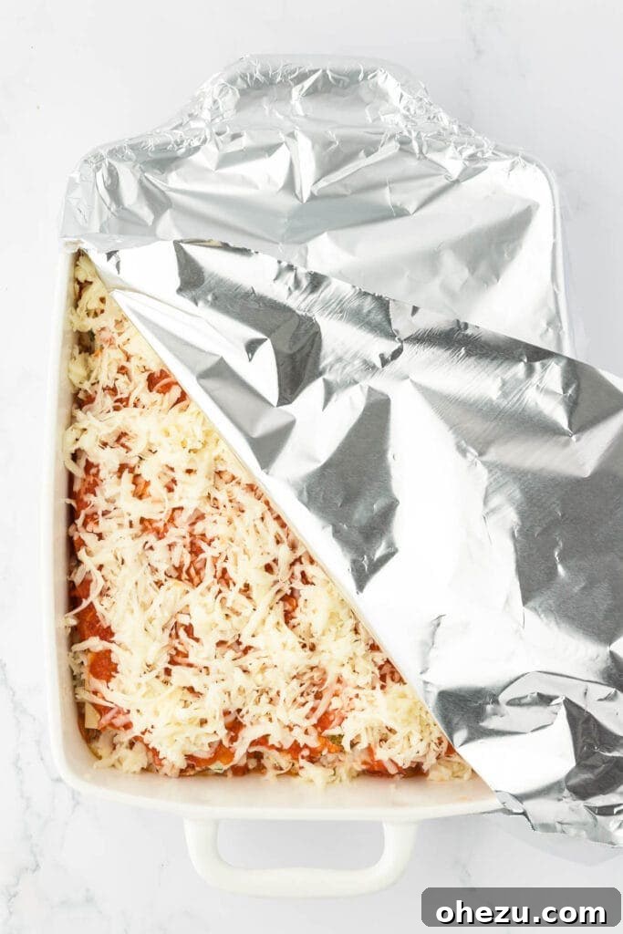 Triple Cheese Lasagna 22 The assembled cheese lasagna, covered tightly with aluminum foil, ready for baking.