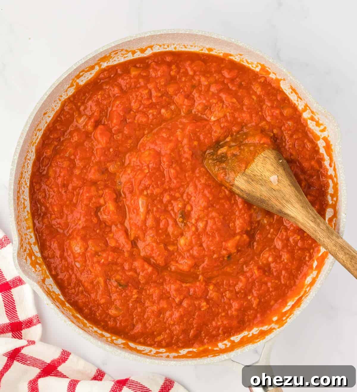 Triple Cheese Lasagna 5 A jar of premium pasta sauce, highlighting the importance of choosing a good quality sauce for lasagna.