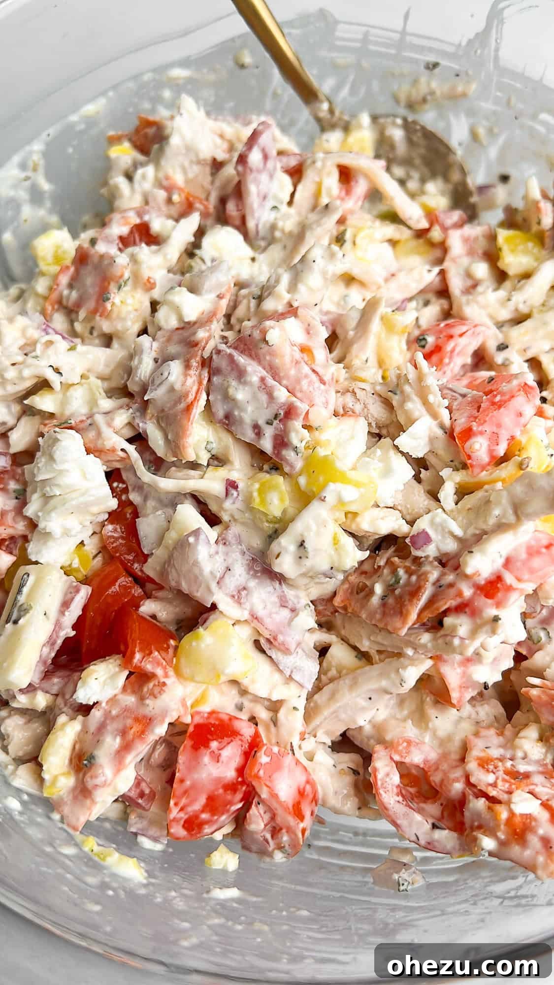 A large bowl of vibrant Italian Grinder Chicken Salad, perfectly mixed and ready to be served.