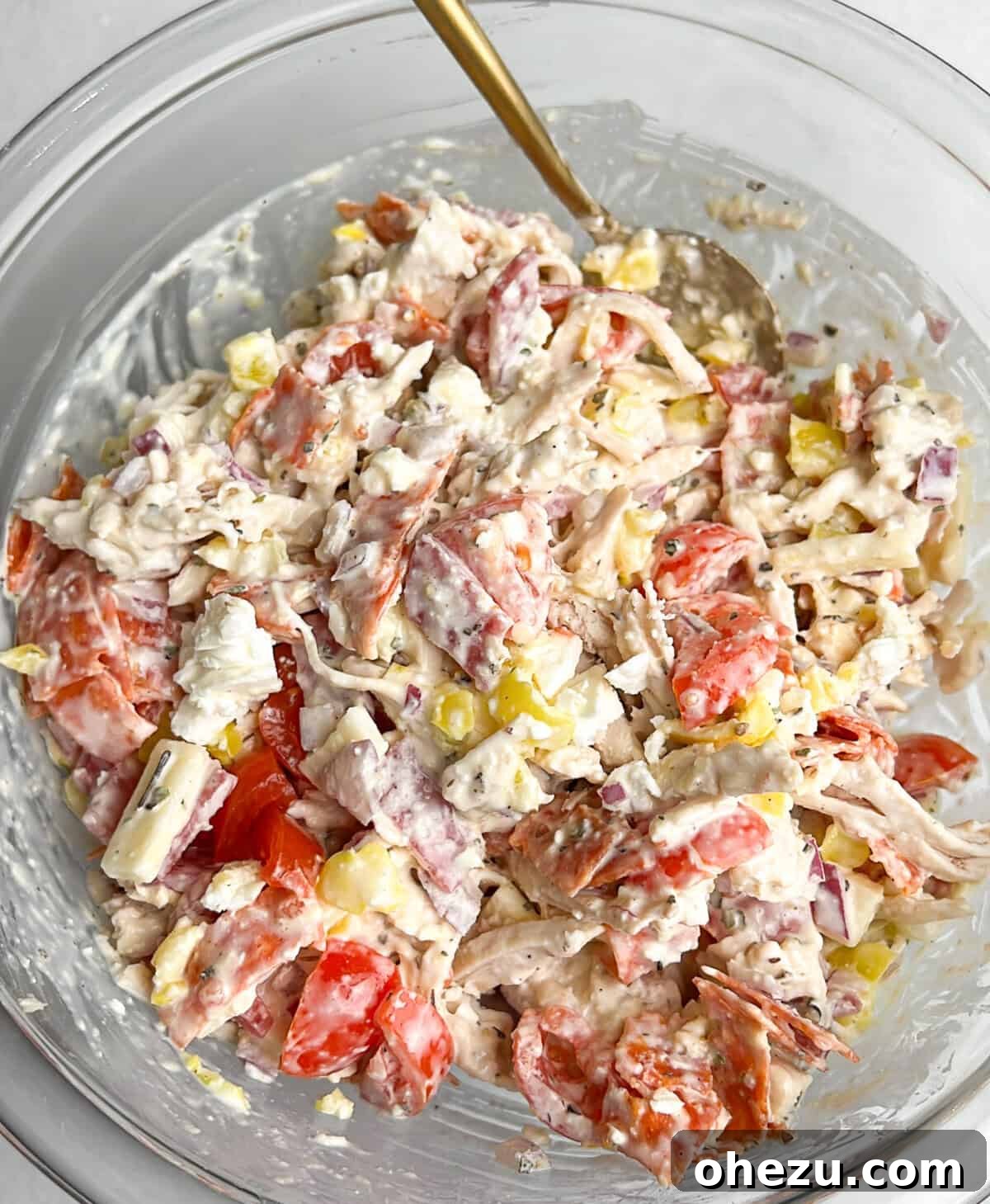 A beautifully presented bowl of Italian Grinder Chicken Salad, highlighting its inviting texture and colorful ingredients.
