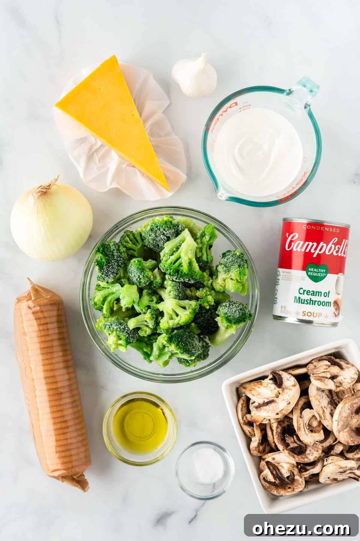 Ingredients needed to make broccoli casserole with Ritz crackers, neatly arranged on a counter