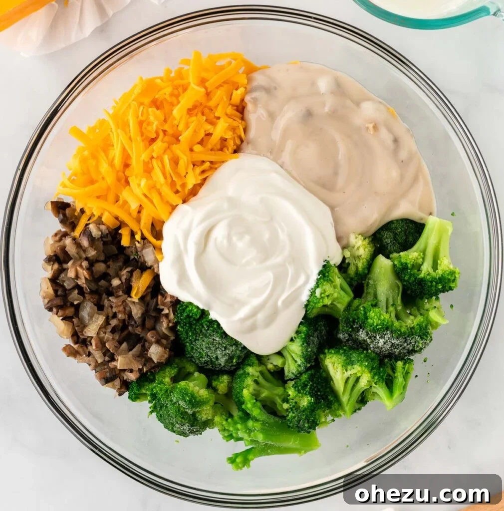 Broccoli casserole ingredients in a mixing bowl before stirring, showing texture
