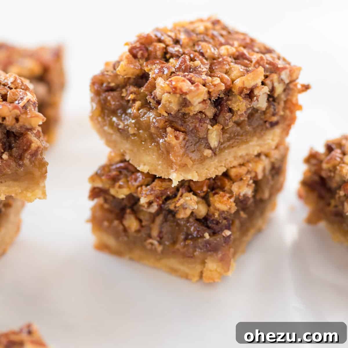 pecan pie bars stacked on top of each other