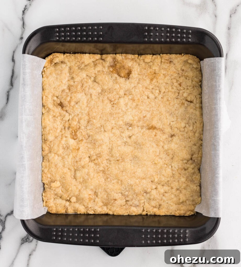 shortbread crust pressed down into an 8 by 8 baking dish
