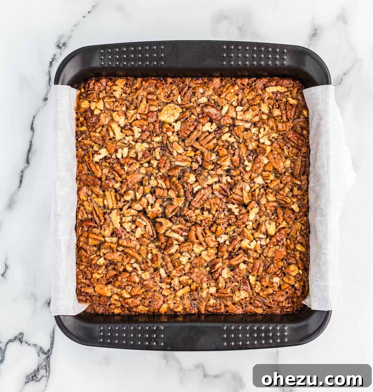 pecan pie bars in an 8 by 8 baking dish
