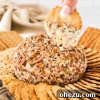 cheese ball surrounded by crackers