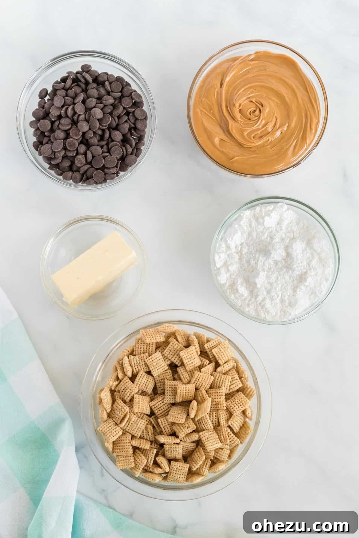 Vegan Chocolate Peanut Butter Cereal Crunch 3 Collection of ingredients to make homemade muddy buddies, including cereal, chocolate chips, and peanut butter