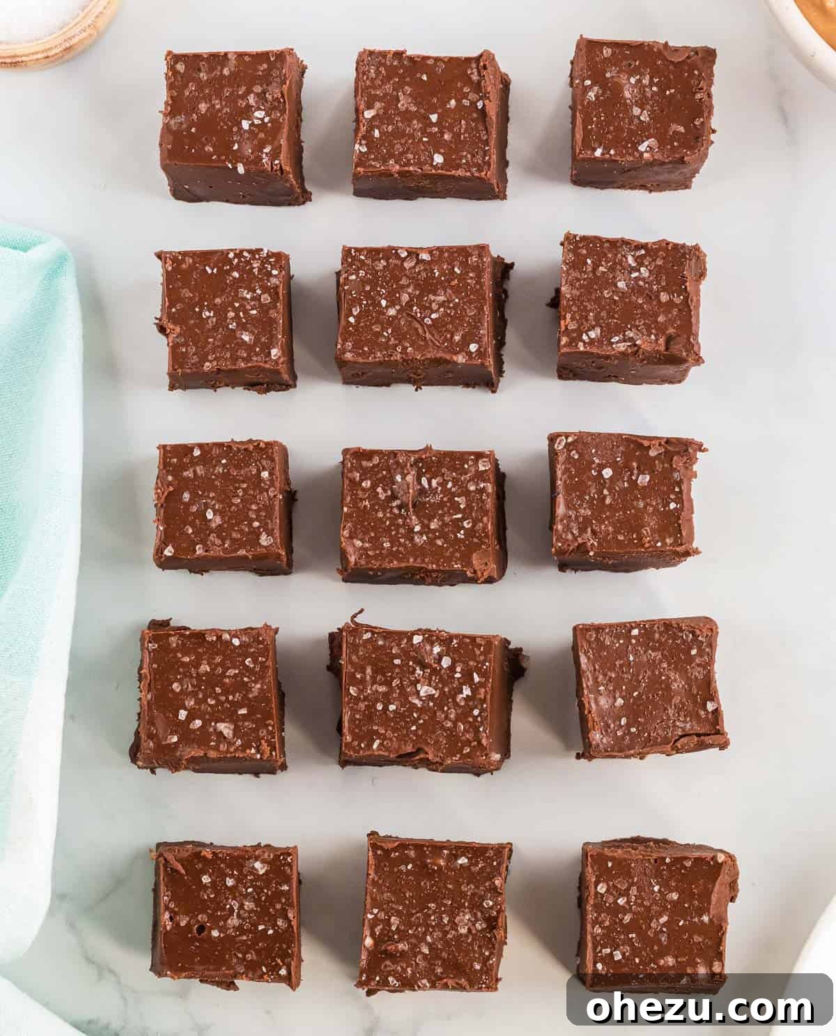 Decadent Vegan Peanut Butter Chocolate Fudge 7 Beautifully cut square pieces of vegan chocolate peanut butter fudge, showcasing their rich texture and perfect shape.