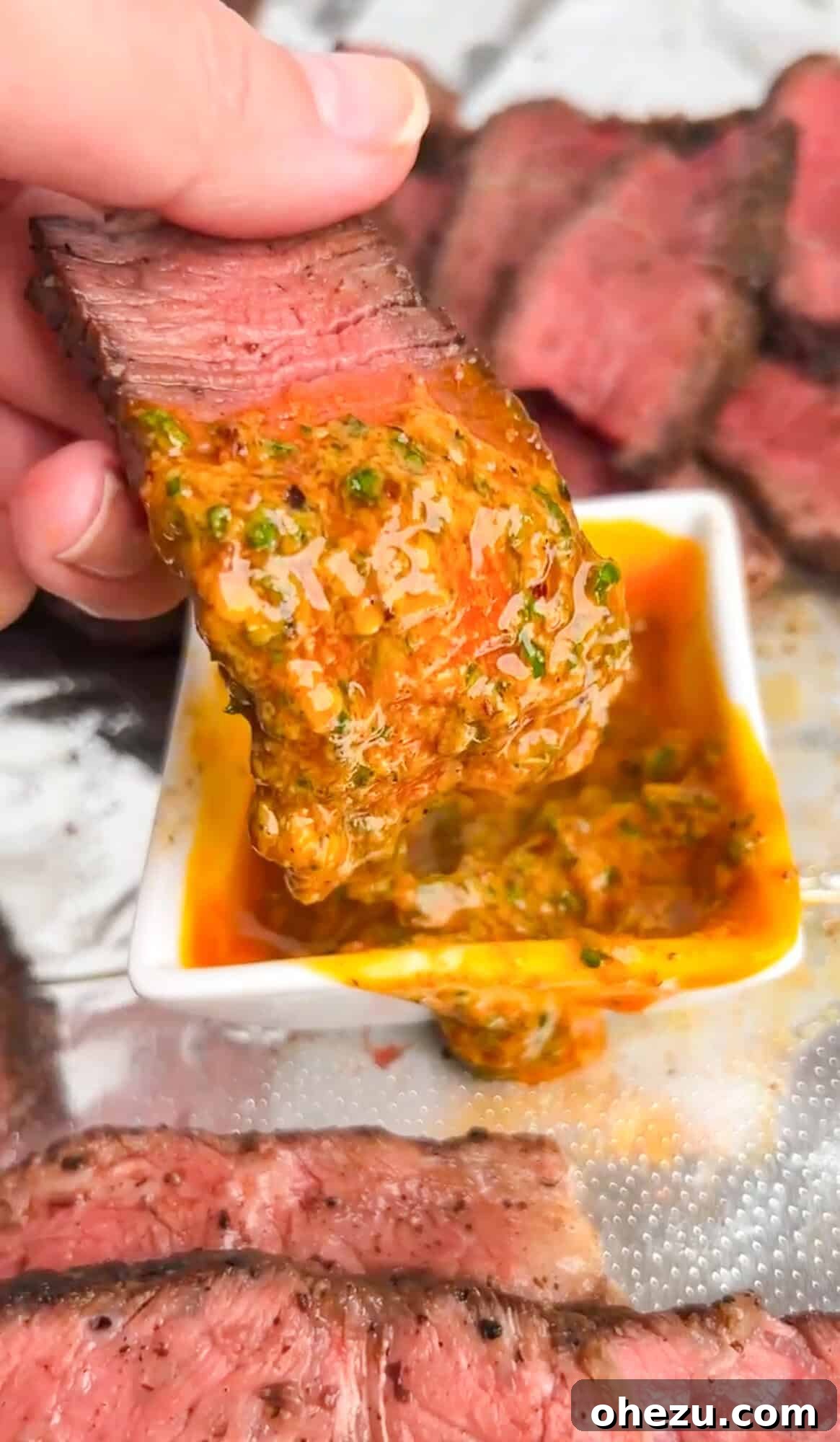 Rustic Herb Butter Steak 4 Close-up of a perfectly seared steak being dipped into a luscious bowl of cowboy butter