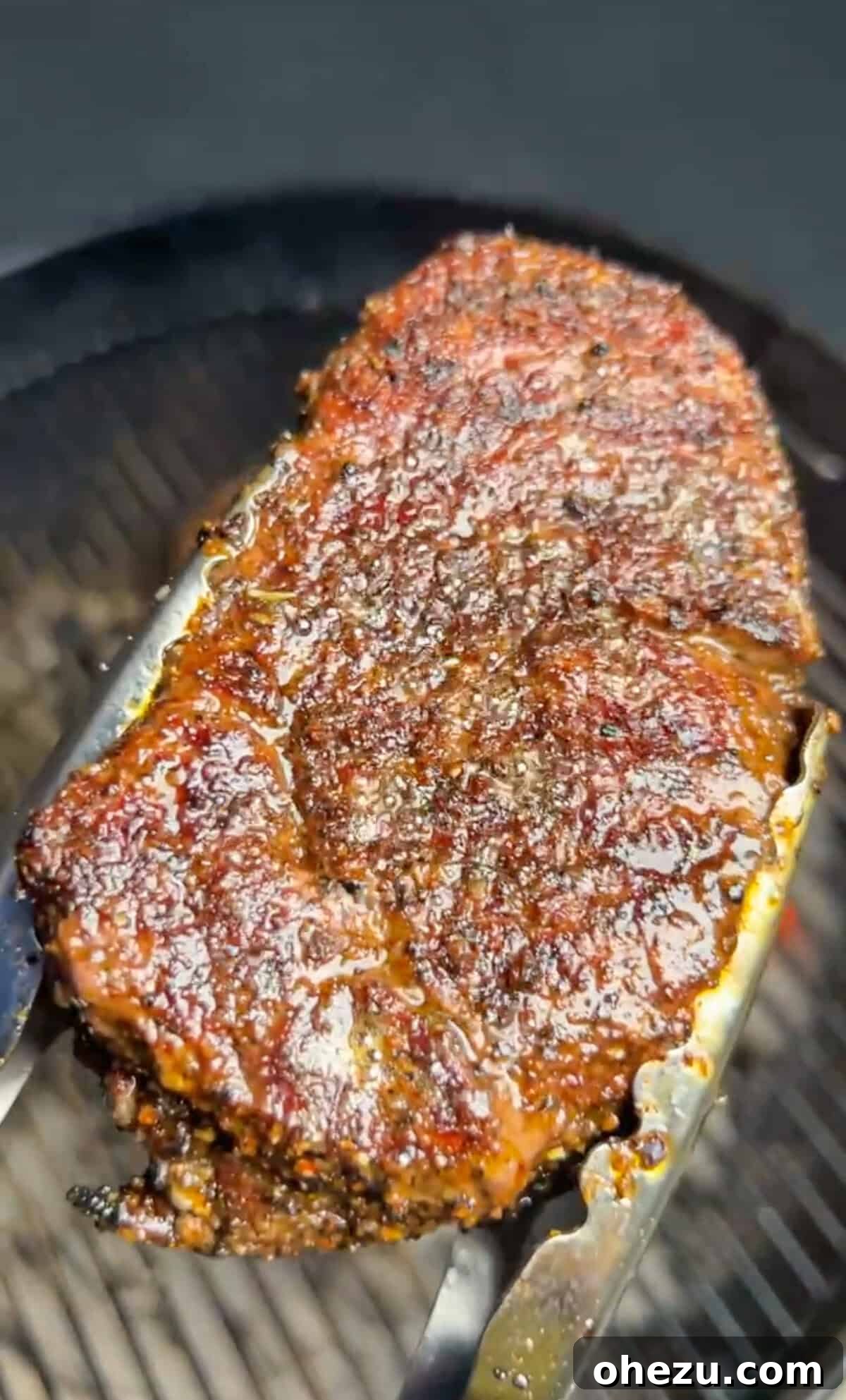 Rustic Herb Butter Steak 8 A thick cut steak cooking to perfection on a hot grill