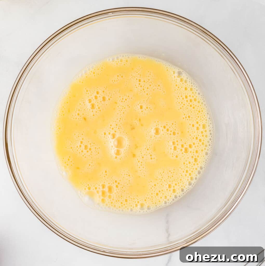 whisked eggs in a mixing bowl