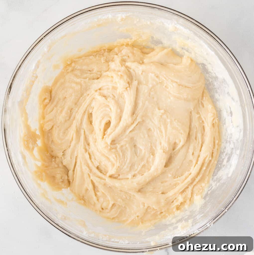 cake mix cookie bar batter in a mixing bowl
