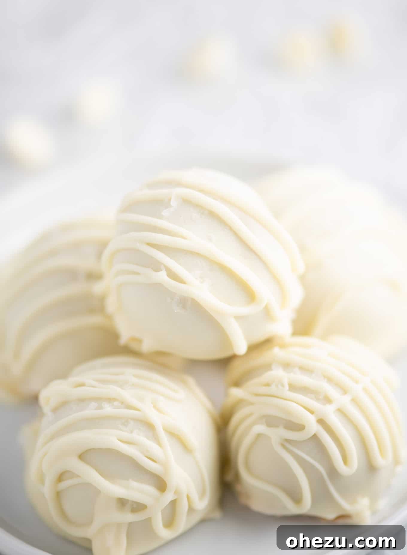 No-Bake White Chocolate Peanut Butter Delights 9 a plate of peanut butter balls