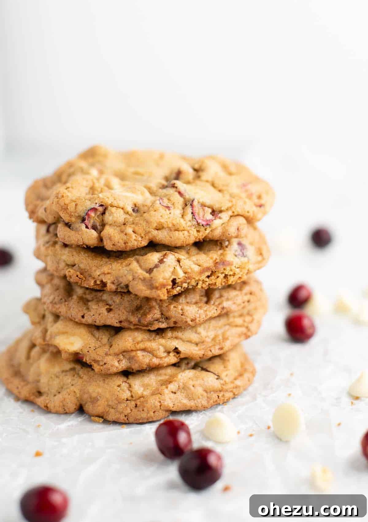 Decadent White Chocolate Cranberry Pecan Cookies 2 Stacked white chocolate cranberry pecan cookies, showcasing their soft texture and festive ingredients