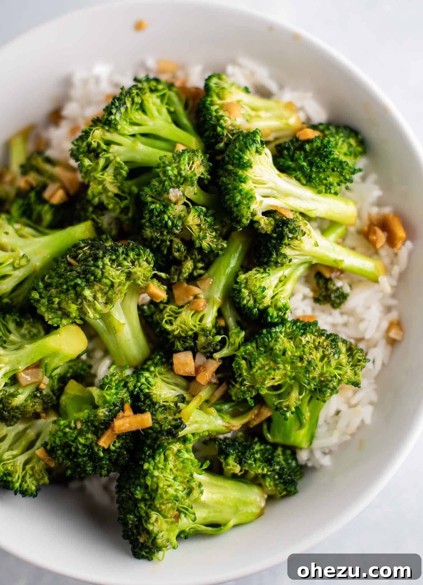 Crisp and Flavorful Broccoli Stir Fry 12 broccoli stir fry with white rice in a white bowl