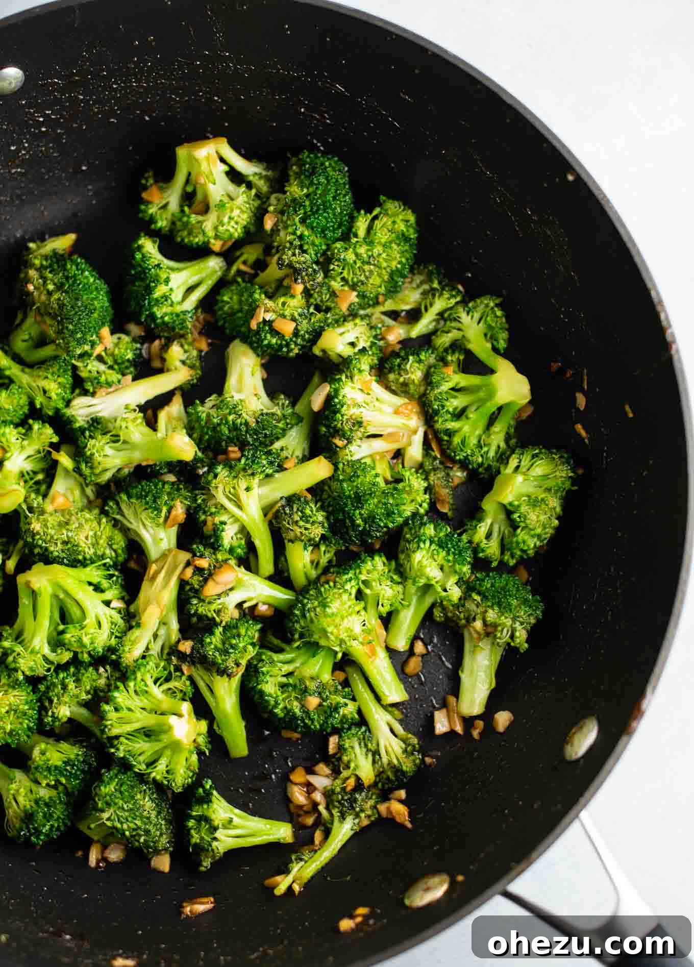 Crisp and Flavorful Broccoli Stir Fry 4 broccoli, garlic, and ginger in a skillet from an overhead view