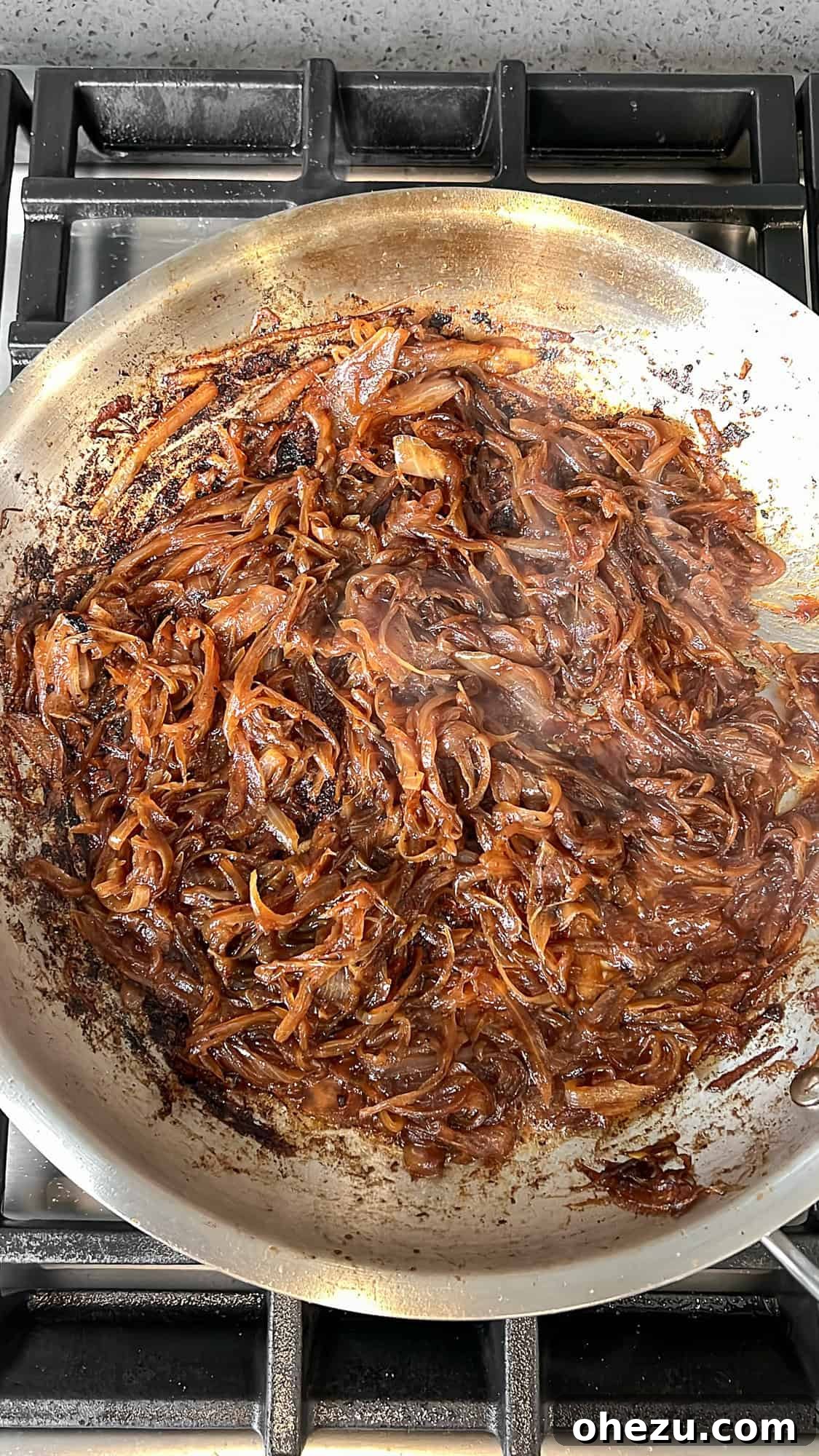 Deeply caramelized onions in the pan, rich golden brown