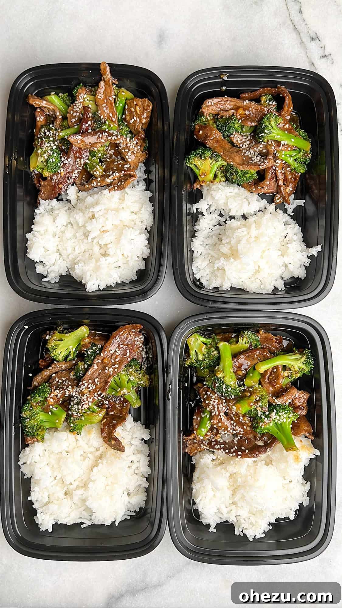 Several meal prep containers filled with beef and broccoli and rice