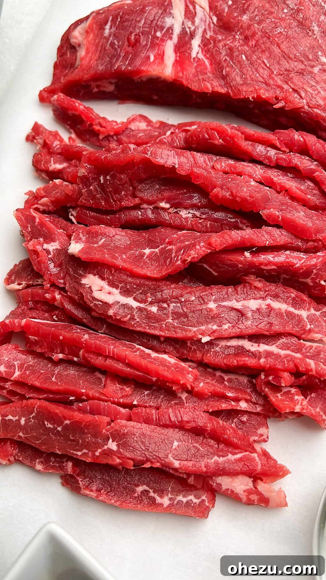 Thinly sliced flank steak, prepped for cooking
