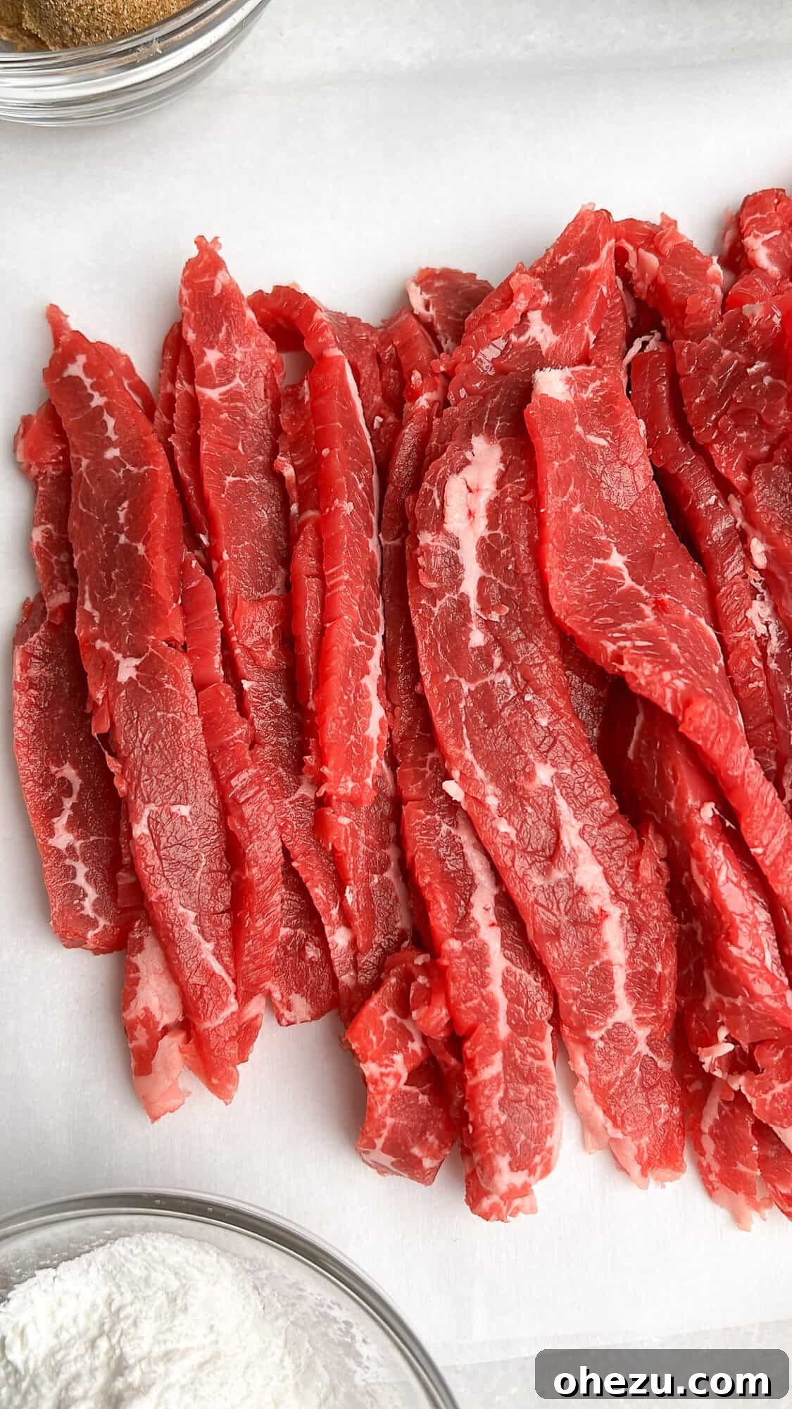 Flank steak expertly cut into thin, uniform slices
