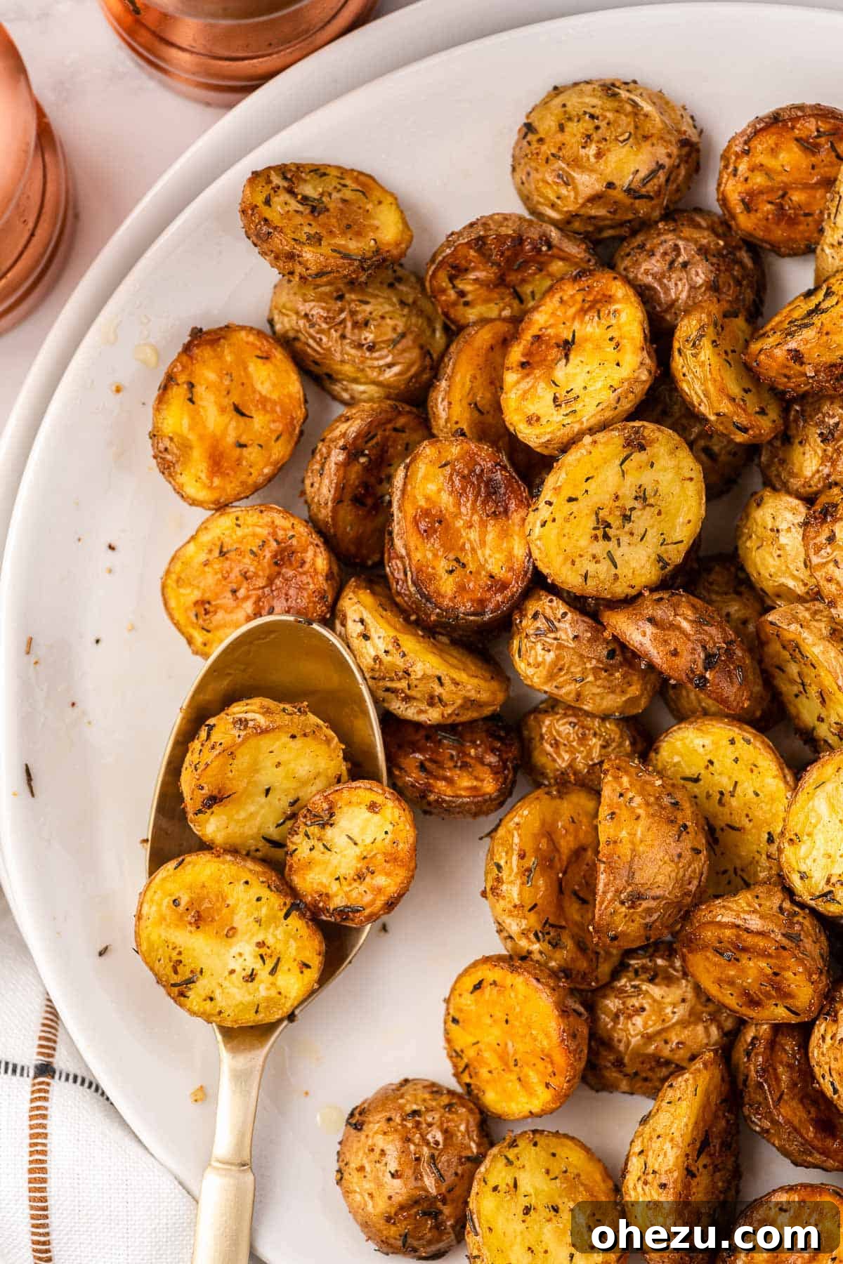 Crispy Air Fryer Baby Potatoes 12 air fryer potatoes on a plate