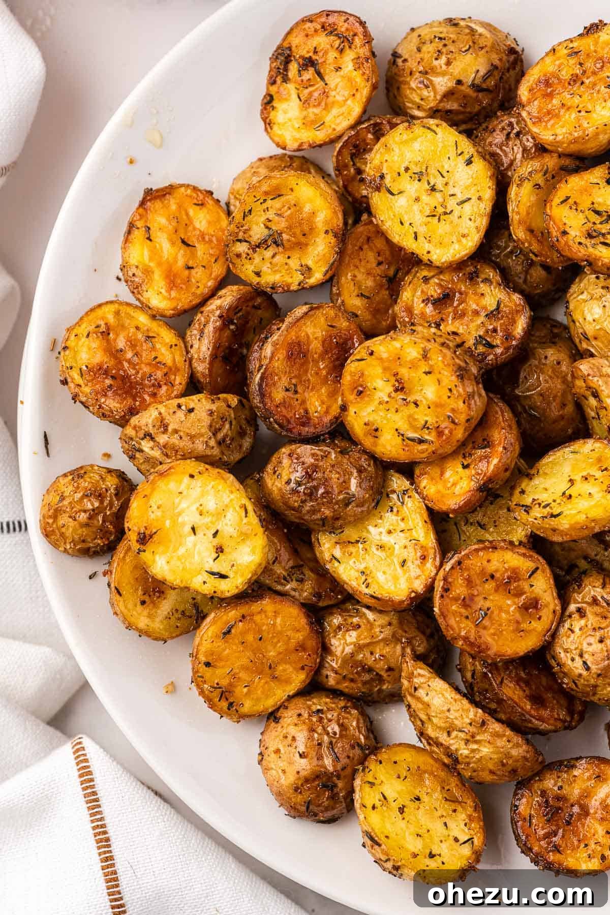 Crispy Air Fryer Baby Potatoes 13 air fryer potatoes on a plate