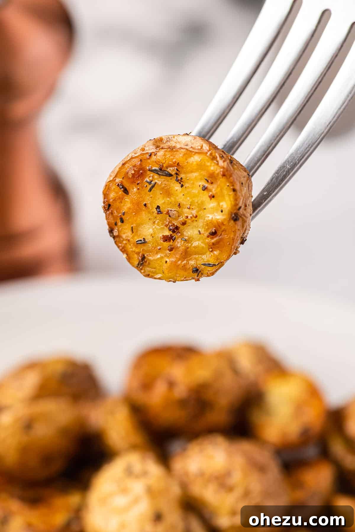 Crispy Air Fryer Baby Potatoes 15 a fork holding a potato bite