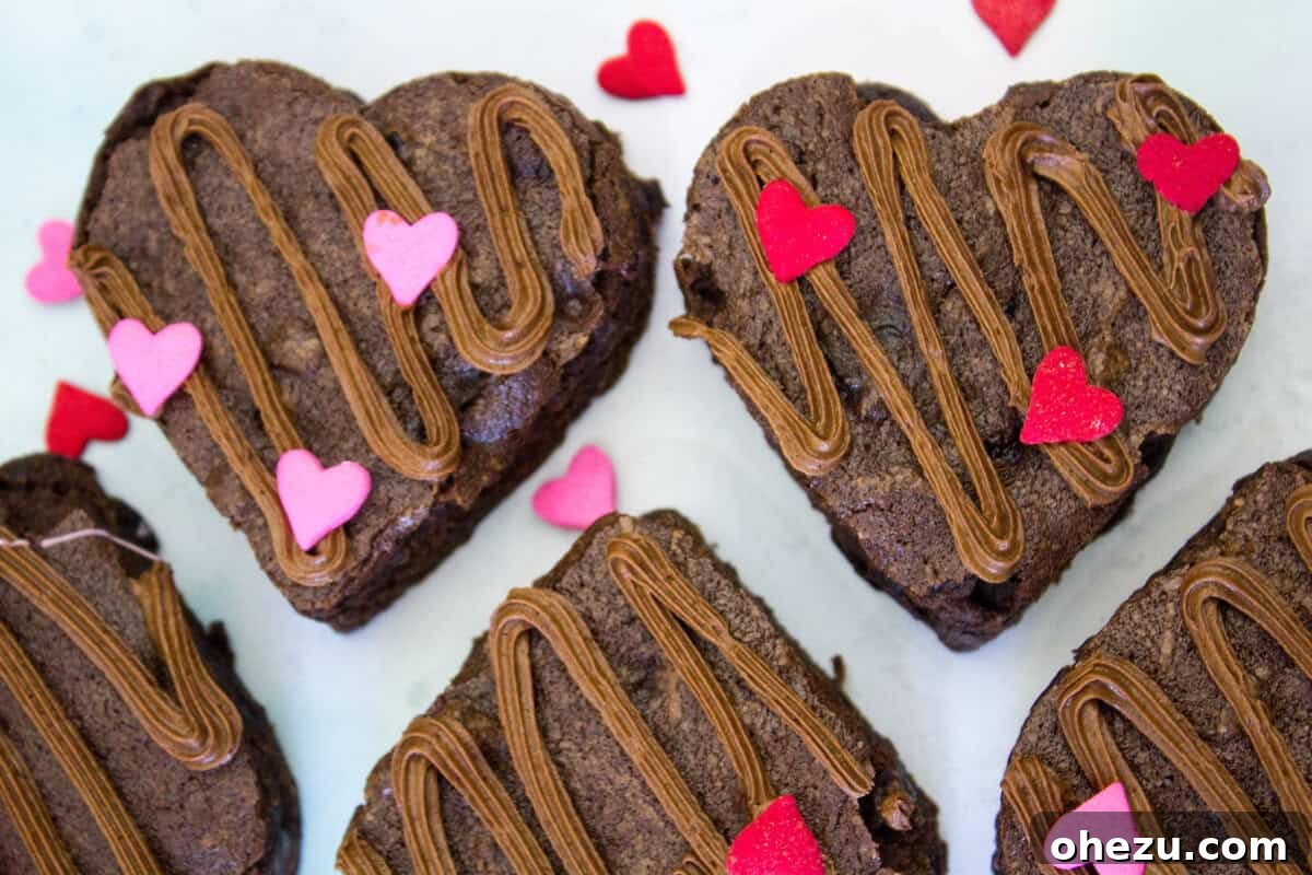 Side view of Cherry Chocolate Valentine Heart Brownies, showing their thick, moist texture.