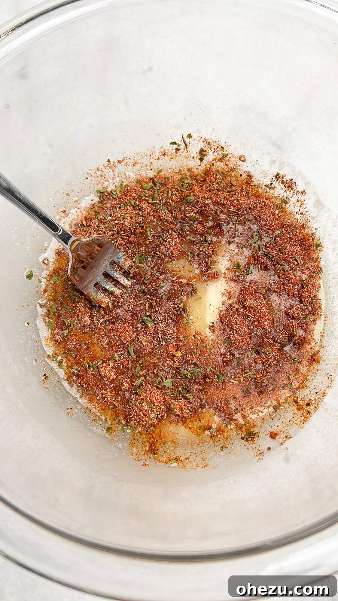 butter and cajun seasoning mixing together