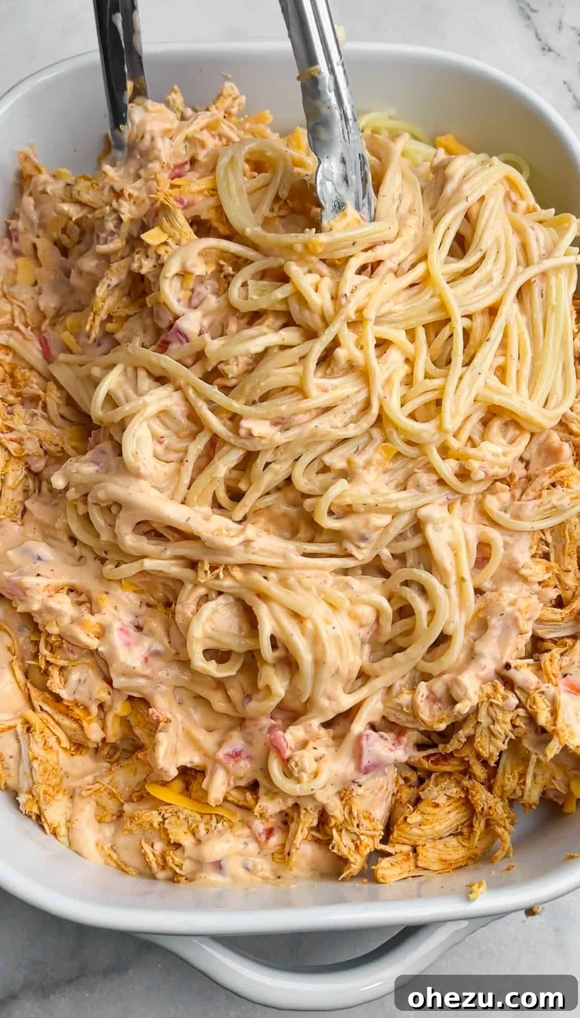 tossing the ingredients together in a casserole dish