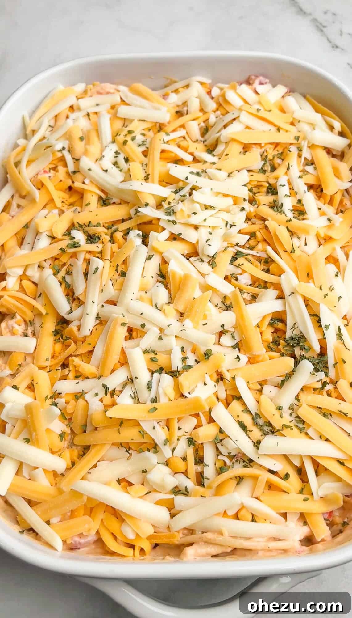 cheese layered over the casserole dish