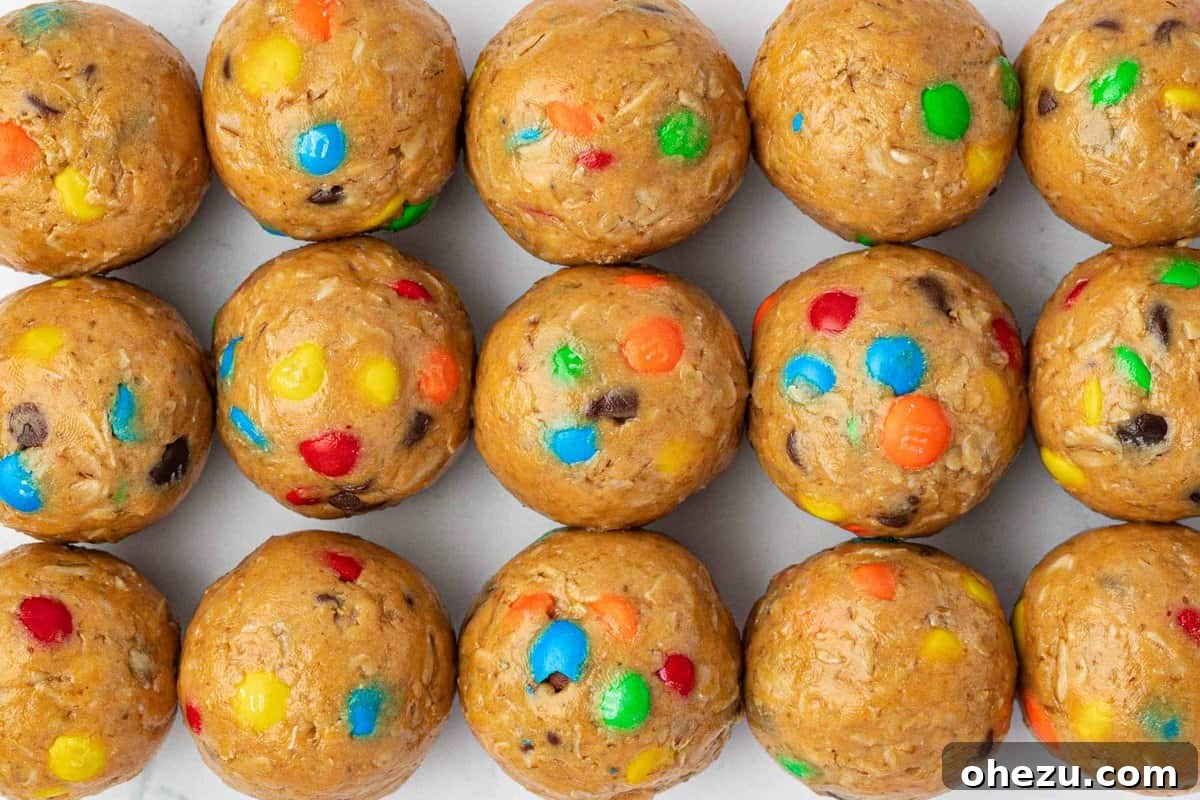 Ultimate Monster Cookie Fuel Bites 14 A wider shot of delicious monster cookie protein balls, showing their texture and inviting colors.