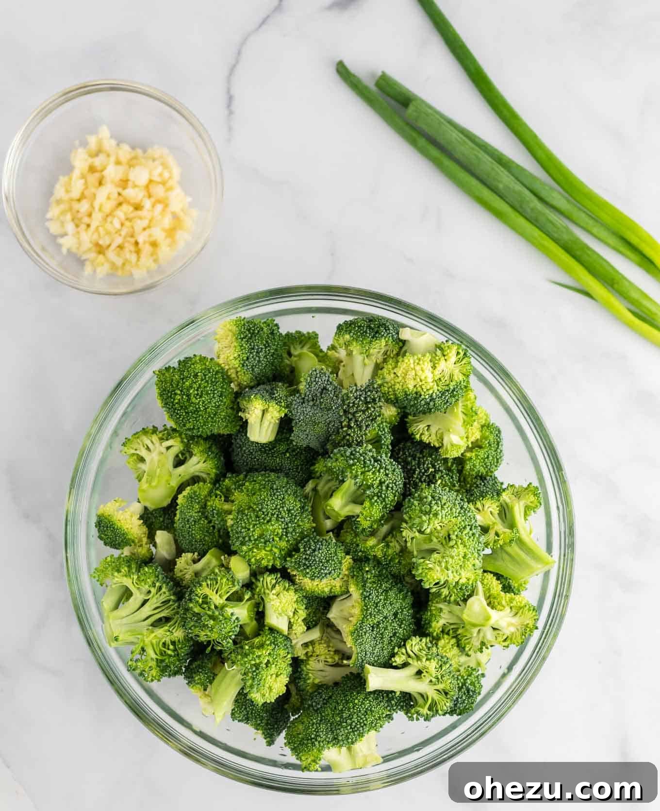 A bowl filled with vibrant green, fresh broccoli florets, ready for cooking