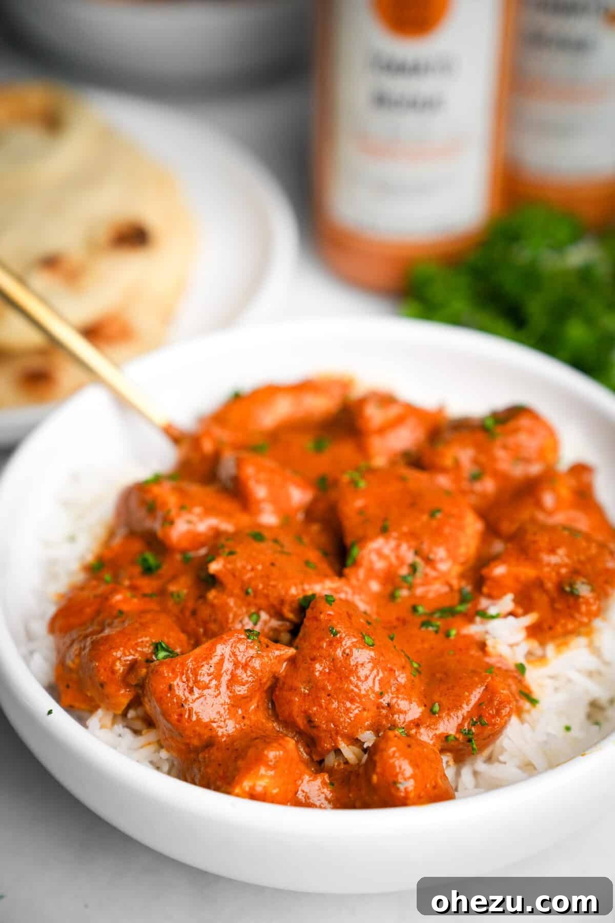 Effortless Butter Chicken 2 A vibrant bowl of butter chicken served over fluffy basmati rice, ready to be enjoyed.