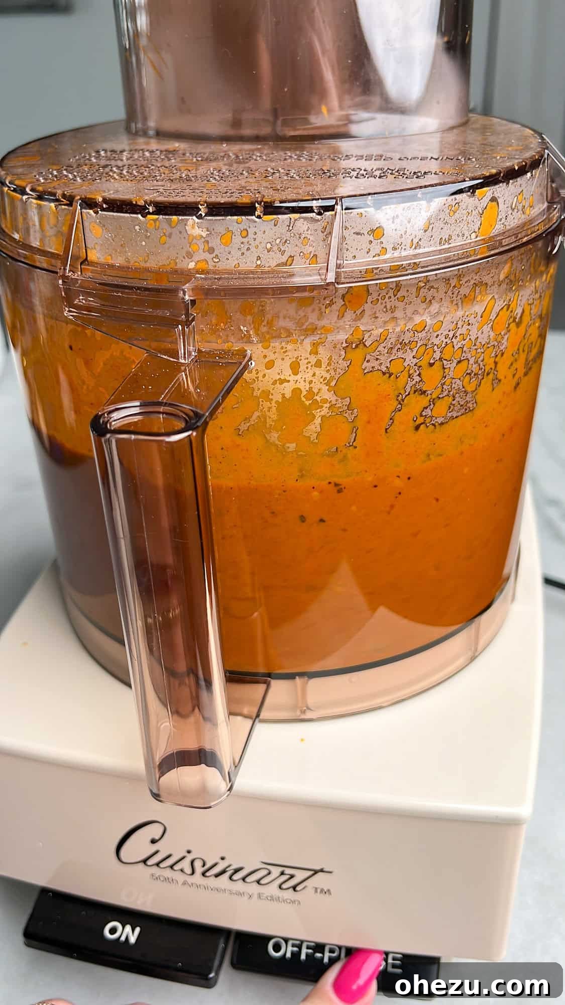 Effortless Butter Chicken 9 The tomato mixture being blended in a food processor to achieve a smooth consistency.