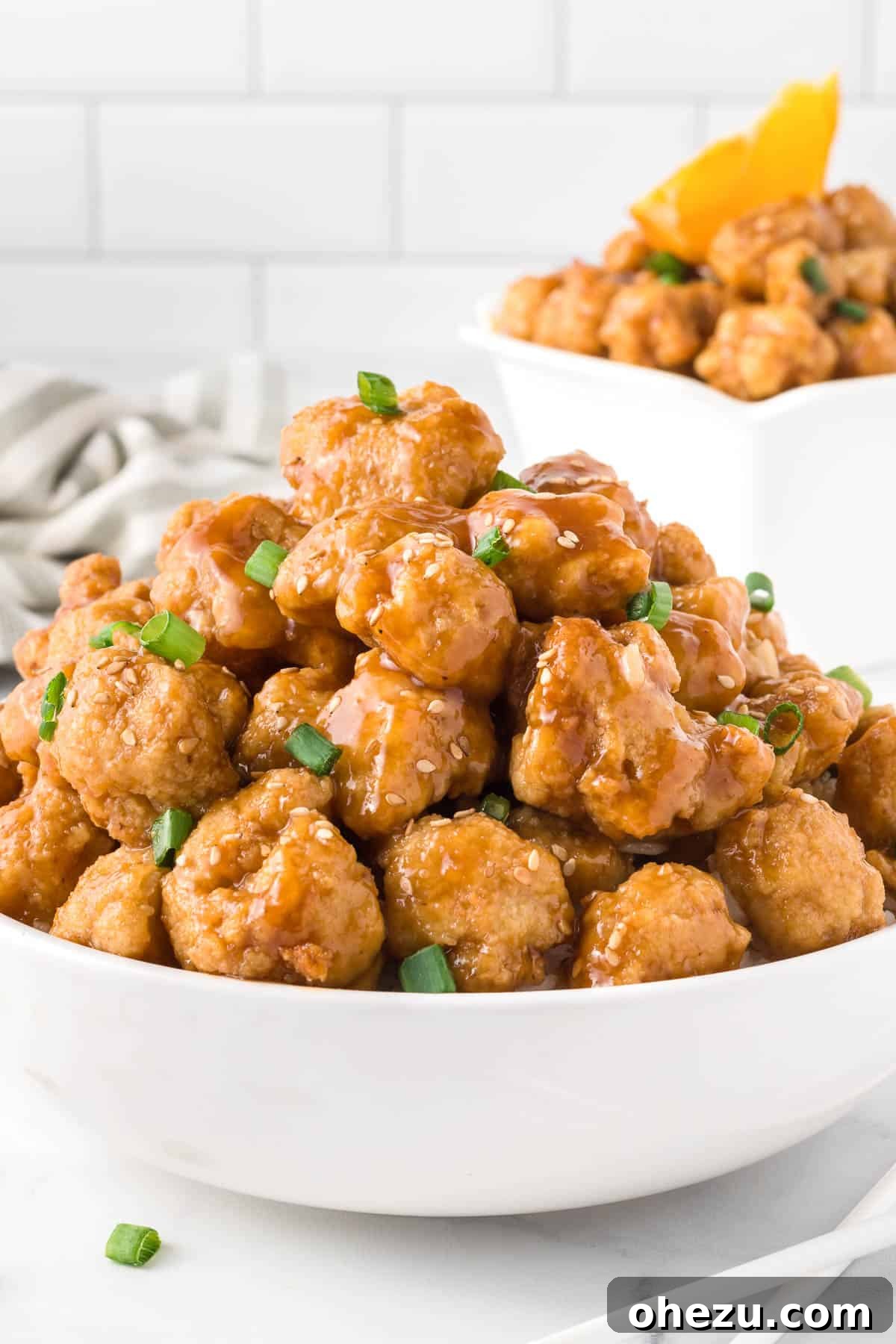 Crispy baked orange cauliflower served in a bowl, ready to eat