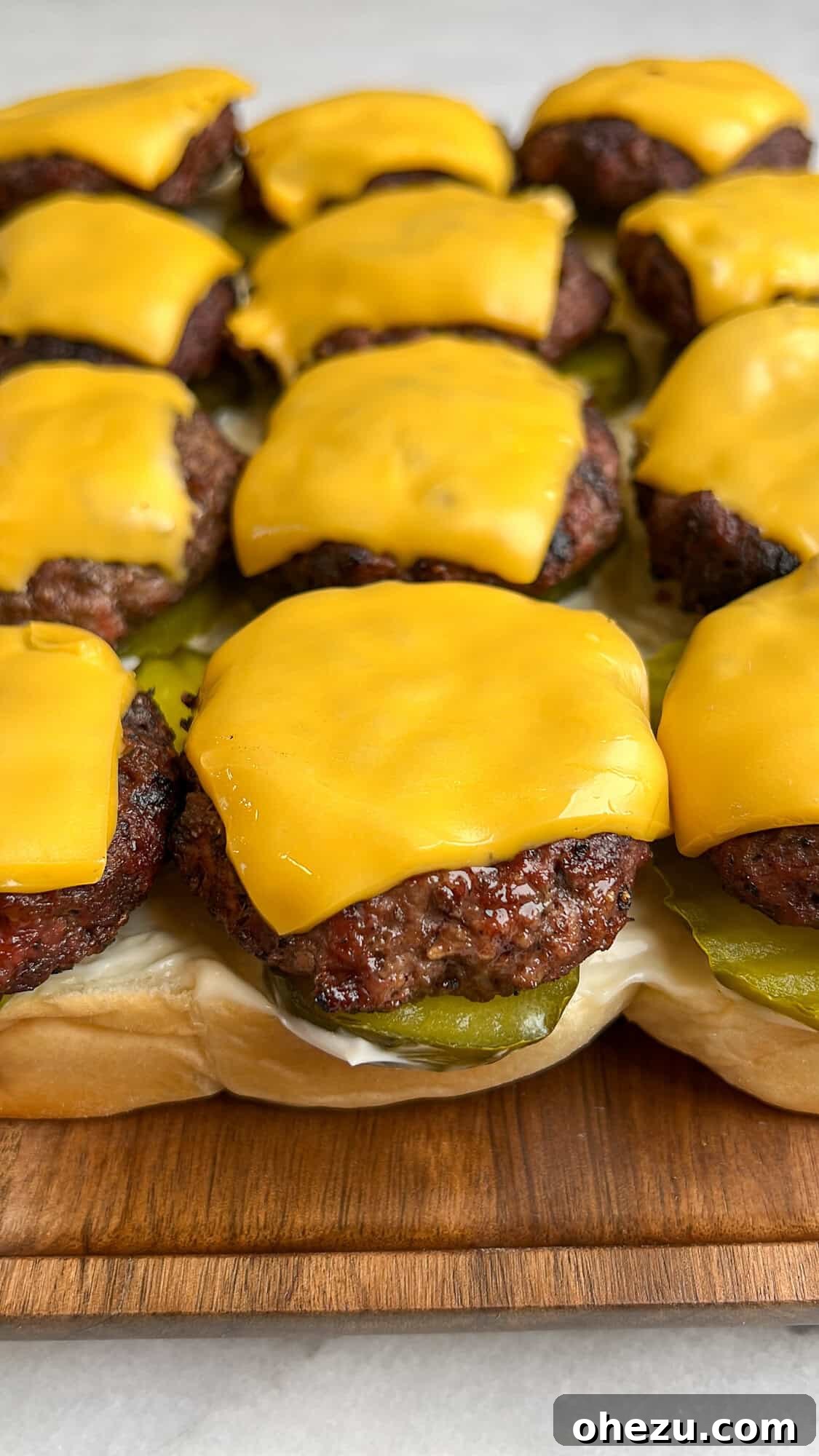 cheeseburger sliders being assembled