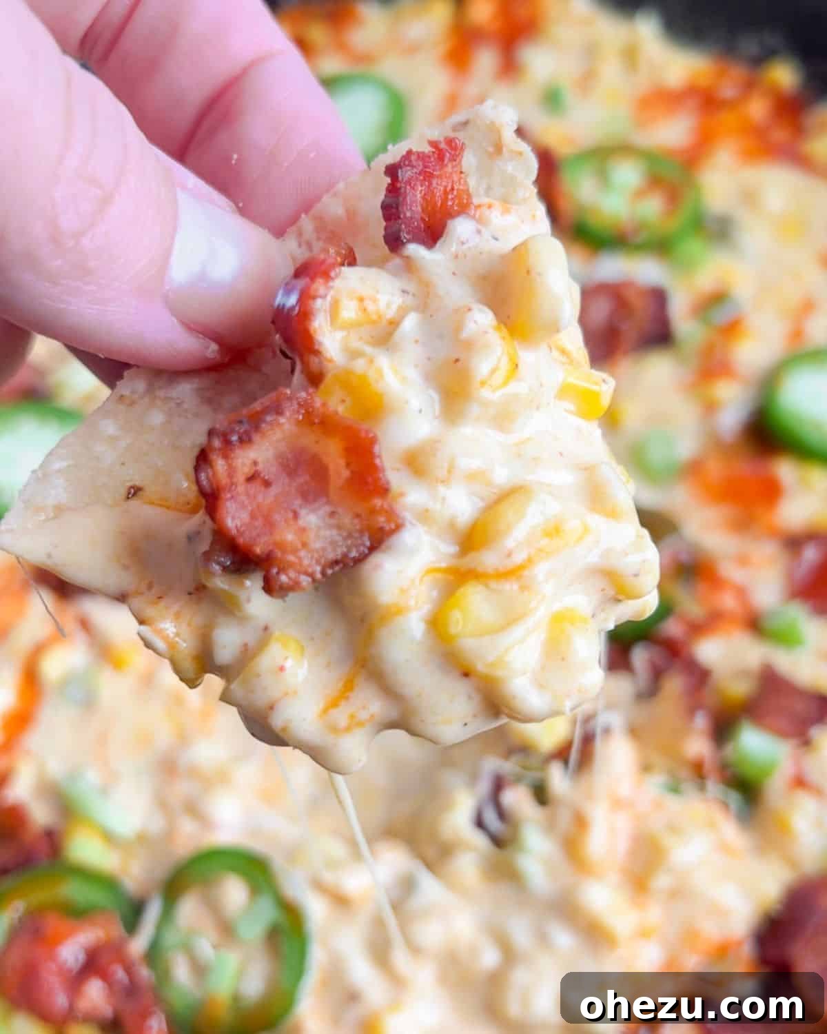 Over 20 Must-Try Recipes for Your Memorial Day Cookout 12 Creamy Bacon Jalapeno Popper Hot Corn Dip, loaded with cheese.