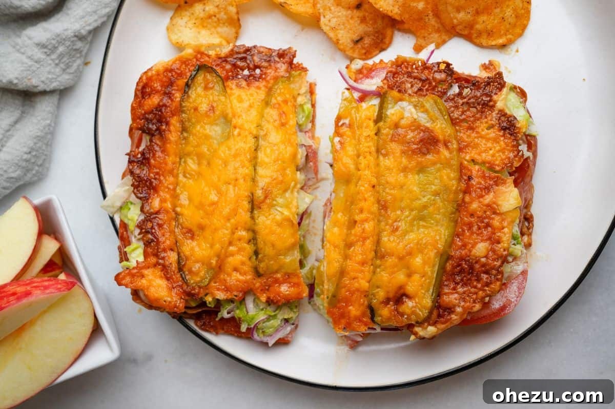 A freshly made, inviting pickle sandwich presented on a plate, ready to be enjoyed as a delightful meal.