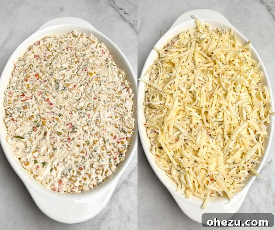 The finished baked corn dip in a casserole dish, topped with melted cheese and fresh green onions, ready for serving.