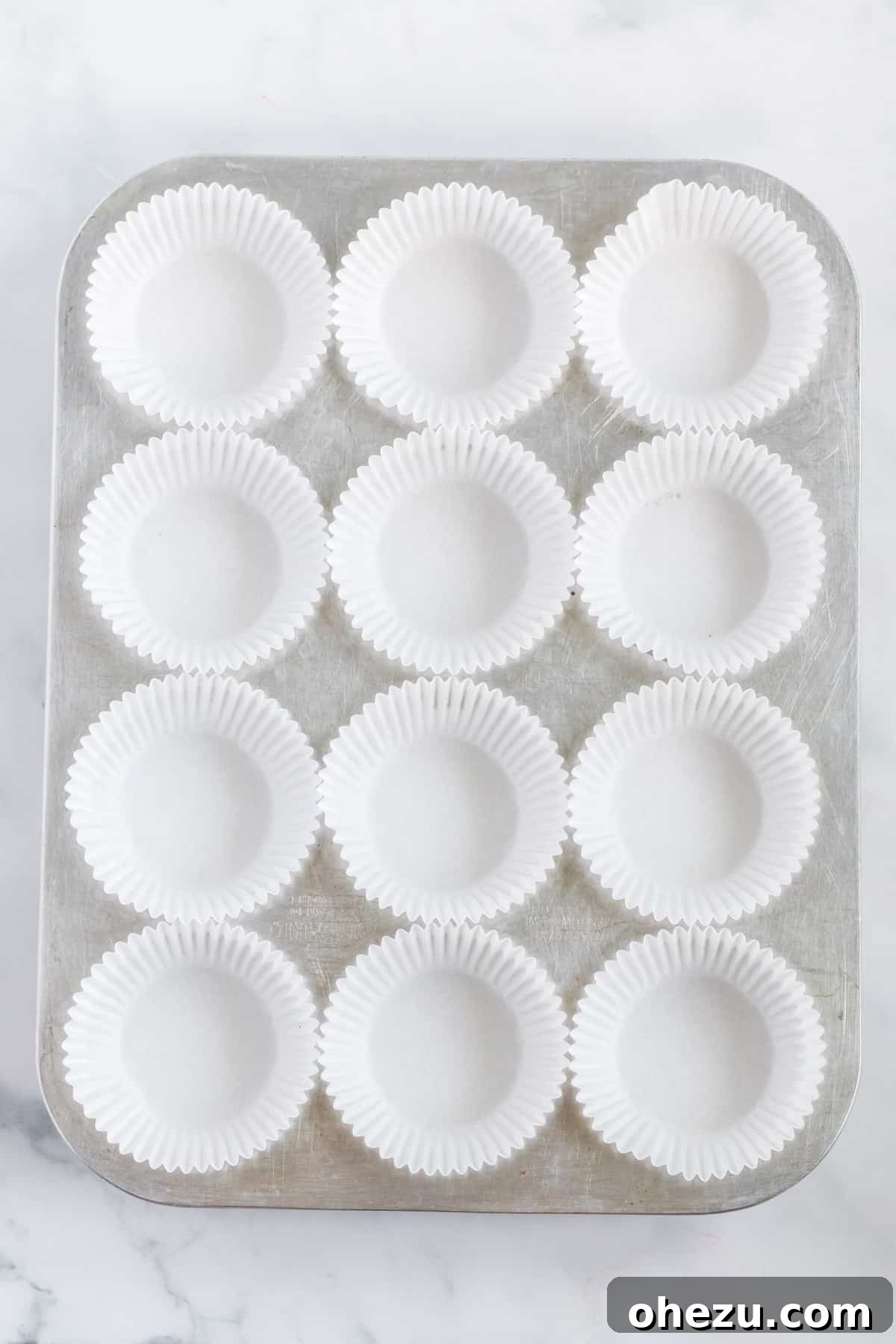 Decadent Vegan Peanut Butter Cups 5 muffin tin lined with white muffin liners