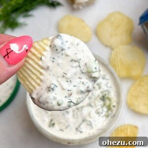 chip dip being held in hand