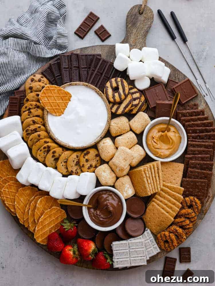 An elaborate S'mores Charcuterie Board filled with chocolates, marshmallows, and graham crackers.